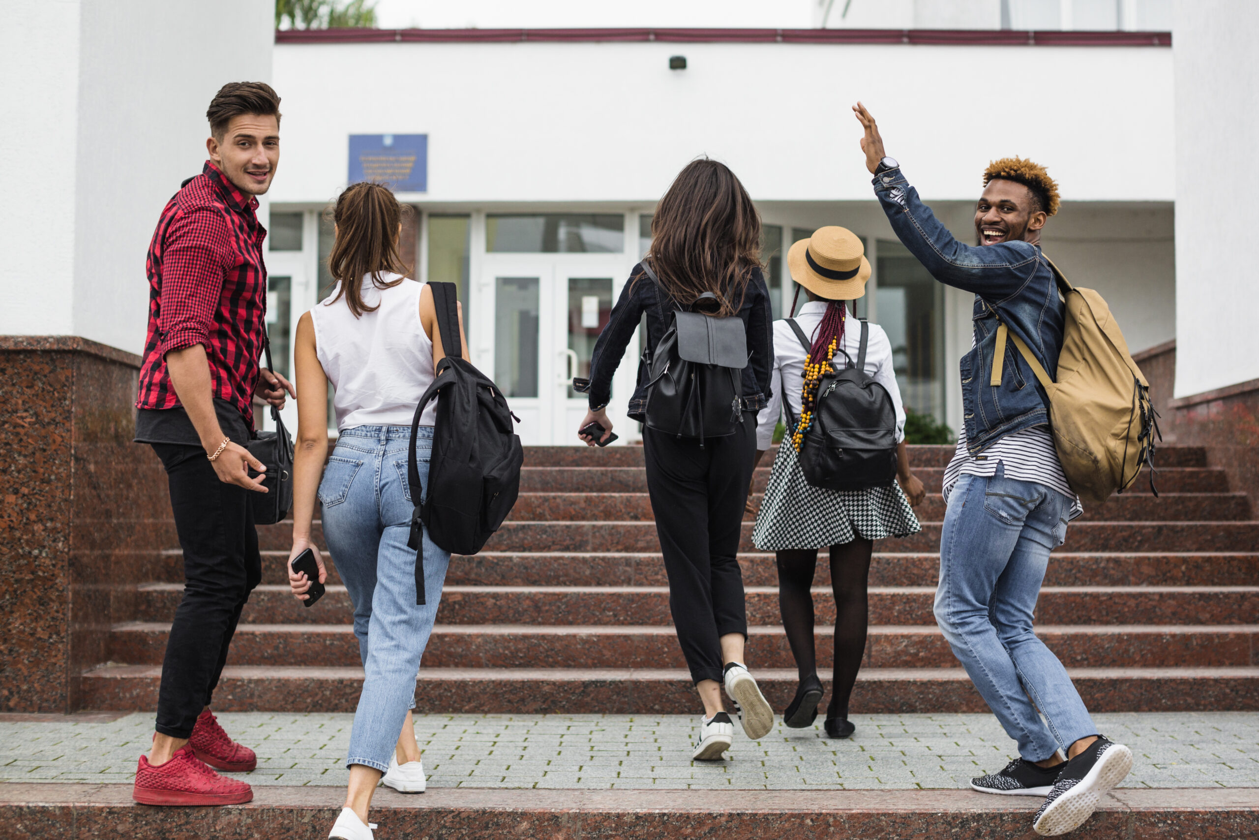 young-students-walking-up-stairs